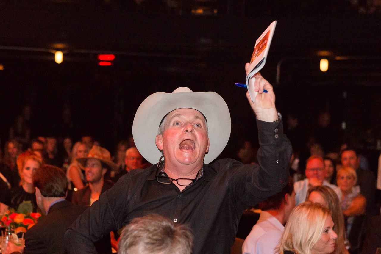 Cowboy Auctioneer ringman at a fundraising event