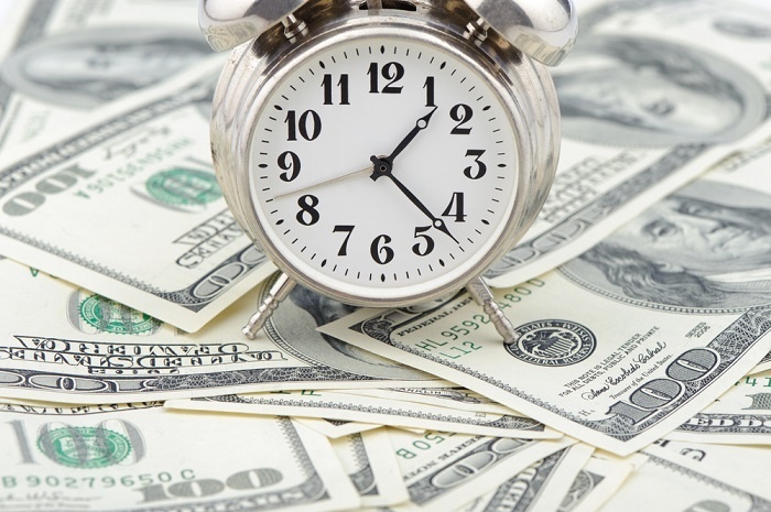 clock on pile of money sm.jpg