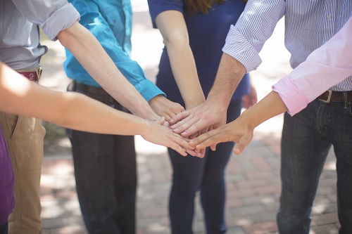 Putting Hands Together During a Teambuilding 